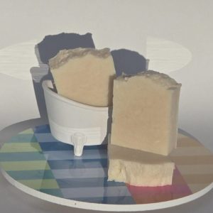 Two bars of coconut soap on a decorative plate